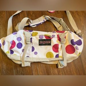 JanSport polka dot duffle bag.